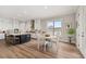 Bright kitchen with a center island, hardwood floors and an adjacent dining area at 231 Laurel Vista Dr, Canton, GA 30114