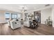 Bright and airy living room featuring stylish furniture, a fireplace, hardwood floors and large windows at 231 Laurel Vista Dr, Canton, GA 30114