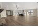 Open floor plan with kitchen, living room and stone fireplace, wood floors and a lot of natural light at 231 Laurel Vista Dr, Canton, GA 30114