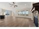Open living room featuring hardwood floors, fireplace, and a wall of windows offering scenic views at 231 Laurel Vista Dr, Canton, GA 30114
