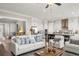 Open-concept living room and kitchen area featuring stylish furniture and a neutral color palette at 231 Laurel Vista Dr, Canton, GA 30114