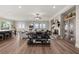 Open-concept living space with wood floors, a stone fireplace, a view of the kitchen and dining area at 231 Laurel Vista Dr, Canton, GA 30114