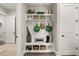 Mudroom featuring a built-in bench, storage, and coat hooks for organization and convenience at 231 Laurel Vista Dr, Canton, GA 30114
