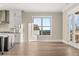 Open floor plan with kitchen and doors leading to the outdoor deck, great natural light and views at 231 Laurel Vista Dr, Canton, GA 30114
