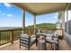 Relaxing outdoor seating area with comfortable chairs and mountain views from the deck at 231 Laurel Vista Dr, Canton, GA 30114
