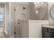 Contemporary shower featuring a glass enclosure, dark hardware and fixtures, with neutral tile and shower niche at 231 Laurel Vista Dr, Canton, GA 30114