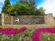Entrance sign for Laurel Canyon Fairways of Canton Golf Club with colorful flowers at 231 Laurel Vista Dr, Canton, GA 30114