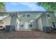 Back exterior of home featuring multiple windows and outdoor patio space at 2735 Snapfinger Mnr, Decatur, GA 30035