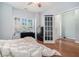 Cozy bedroom with vaulted ceiling, natural light, and wood-look flooring at 2735 Snapfinger Mnr, Decatur, GA 30035