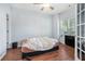 Bedroom featuring hardwood floors, a ceiling fan, and a window letting in natural light at 2735 Snapfinger Mnr, Decatur, GA 30035