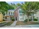 Charming townhome with a brick facade, well-manicured lawn, and inviting front porch, perfect for relaxing outdoors at 2735 Snapfinger Mnr, Decatur, GA 30035