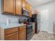 Well-equipped kitchen with wood cabinets, stainless steel appliances, and ample counter space, perfect for cooking at 2735 Snapfinger Mnr, Decatur, GA 30035