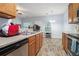 Functional kitchen with wood cabinets, stainless steel appliances, and view to living area, perfect for entertaining at 2735 Snapfinger Mnr, Decatur, GA 30035