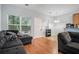 Comfortable living room featuring gray sofas, neutral walls, and ample natural light, perfect for a cozy atmosphere at 2735 Snapfinger Mnr, Decatur, GA 30035