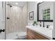 Updated bathroom showcasing a tiled shower and modern vanity with ample lighting at 2849 Knotty Pine Ct, Buford, GA 30519