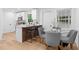 Bright kitchen with white cabinets, stainless appliances, and an eat-in dining area with great natural light at 2849 Knotty Pine Ct, Buford, GA 30519