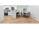 Modern eat-in kitchen features white cabinets, stainless steel appliances, and a breakfast bar at 2849 Knotty Pine Ct, Buford, GA 30519