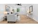 Bright open-concept living area features lots of light, hardwood floors, and modern decor at 2849 Knotty Pine Ct, Buford, GA 30519
