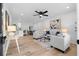 Bright open-concept living area features modern decor, hardwood floors, and recessed lighting at 2849 Knotty Pine Ct, Buford, GA 30519