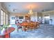 This common area has two dining tables, a seating area, a bookshelf and an elevator at 351 Ne Washington Ne Ave # 307, Marietta, GA 30060