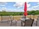 Outdoor area with a table, chairs, and umbrella overlooking a lush green valley view at 351 Ne Washington Ne Ave # 307, Marietta, GA 30060