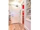 View of entryway showcasing hardwood floors, a storage nook and view into a secondary room at 351 Ne Washington Ne Ave # 307, Marietta, GA 30060