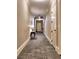 Hallway view with neutral colors, decorative carpet and baseboards leading to apartments on the property at 351 Ne Washington Ne Ave # 307, Marietta, GA 30060