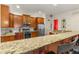 Kitchen with granite counters, wood cabinets, stainless steel appliances, and breakfast bar with seating at 351 Ne Washington Ne Ave # 307, Marietta, GA 30060
