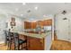 Kitchen with wood cabinets, granite countertops, stainless steel appliances, and bar seating at 351 Ne Washington Ne Ave # 307, Marietta, GA 30060