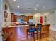 Bright eat-in kitchen features wood cabinets, stainless steel appliances, and granite countertops with a breakfast bar at 351 Ne Washington Ne Ave # 307, Marietta, GA 30060