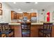 Gourmet kitchen with wood cabinets, granite counters, stainless appliances, and breakfast bar seating at 351 Ne Washington Ne Ave # 307, Marietta, GA 30060