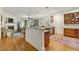 Open-concept kitchen and living room featuring a fireplace, hardwood floors, and breakfast bar at 351 Ne Washington Ne Ave # 307, Marietta, GA 30060