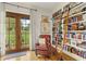 Charming library featuring floor to ceiling bookshelves, a rolling ladder, hardwood floors, and an outside balcony at 351 Ne Washington Ne Ave # 307, Marietta, GA 30060