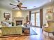 Living room area with fireplace, french doors to balcony, hardwood floors and comfortable furniture at 351 Ne Washington Ne Ave # 307, Marietta, GA 30060