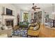 Elegant living room with a fireplace, built-in bookshelves, and hardwood floors at 351 Ne Washington Ne Ave # 307, Marietta, GA 30060