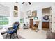 Cozy office with natural light, artwork, and furniture, including view of outside landscape with grave markers at 351 Ne Washington Ne Ave # 307, Marietta, GA 30060