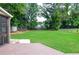 Large backyard with lush green grass, perfect for outdoor activities and Gathering fun at 1206 Tred Avon Sw Way, Lilburn, GA 30047