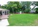 Expansive backyard with a deck, screened porch, and ample space for recreation and relaxation at 1206 Tred Avon Sw Way, Lilburn, GA 30047