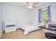 Simple bedroom featuring a white single bed and modern minimalist decor and a window at 1206 Tred Avon Sw Way, Lilburn, GA 30047