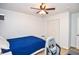 Comfortable bedroom with ceiling fan, large closet, and natural light; perfect for relaxation and restful nights at 1206 Tred Avon Sw Way, Lilburn, GA 30047