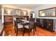 Formal dining room with elegant furniture, hardwood flooring and large mirror at 1206 Tred Avon Sw Way, Lilburn, GA 30047