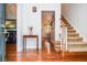 Inviting foyer features hardwood floors, staircase and views into the formal dining and living areas at 1206 Tred Avon Sw Way, Lilburn, GA 30047