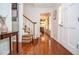 Well-lit foyer with hardwood floors, showcasing the staircase and access to multiple rooms at 1206 Tred Avon Sw Way, Lilburn, GA 30047