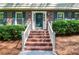 Charming brick stairs leading to the front door with classic shutters and well-maintained landscaping at 1206 Tred Avon Sw Way, Lilburn, GA 30047