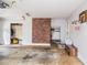 Clean garage with a brick accent wall, storage area, and a basketball hoop at 1206 Tred Avon Sw Way, Lilburn, GA 30047