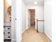 Bright hallway with fresh paint and carpet, leading to an updated bathroom with a modern vanity at 1206 Tred Avon Sw Way, Lilburn, GA 30047
