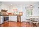 Bright kitchen with stainless steel appliances, white cabinetry, and a cozy breakfast nook at 1206 Tred Avon Sw Way, Lilburn, GA 30047