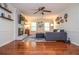 Inviting living room featuring a gray couch, decorative fireplace, and beautiful hardwood floors at 1206 Tred Avon Sw Way, Lilburn, GA 30047