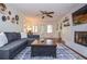 Bright living room boasting hardwood floors, a cozy fireplace, and a comfortable sectional sofa at 1206 Tred Avon Sw Way, Lilburn, GA 30047