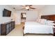Spacious primary bedroom featuring a king bed, TV, and access to the bathroom, providing a relaxing retreat at 1206 Tred Avon Sw Way, Lilburn, GA 30047